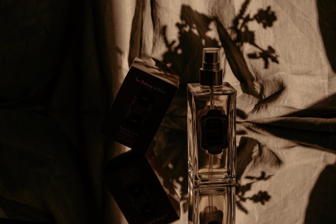 A collection of perfume bottles arranged by season, showcasing different colors and styles that represent spring, summer, autumn, and winter.