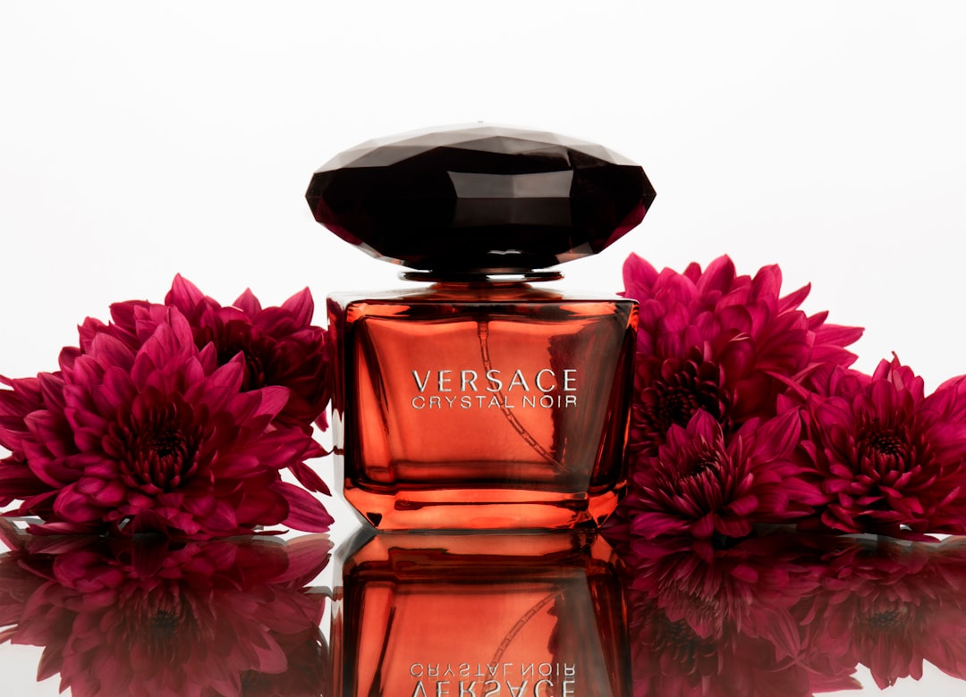 A beautifully arranged selection of various perfume bottles in elegant packaging, showcasing different styles and colors, ideal for gifting.