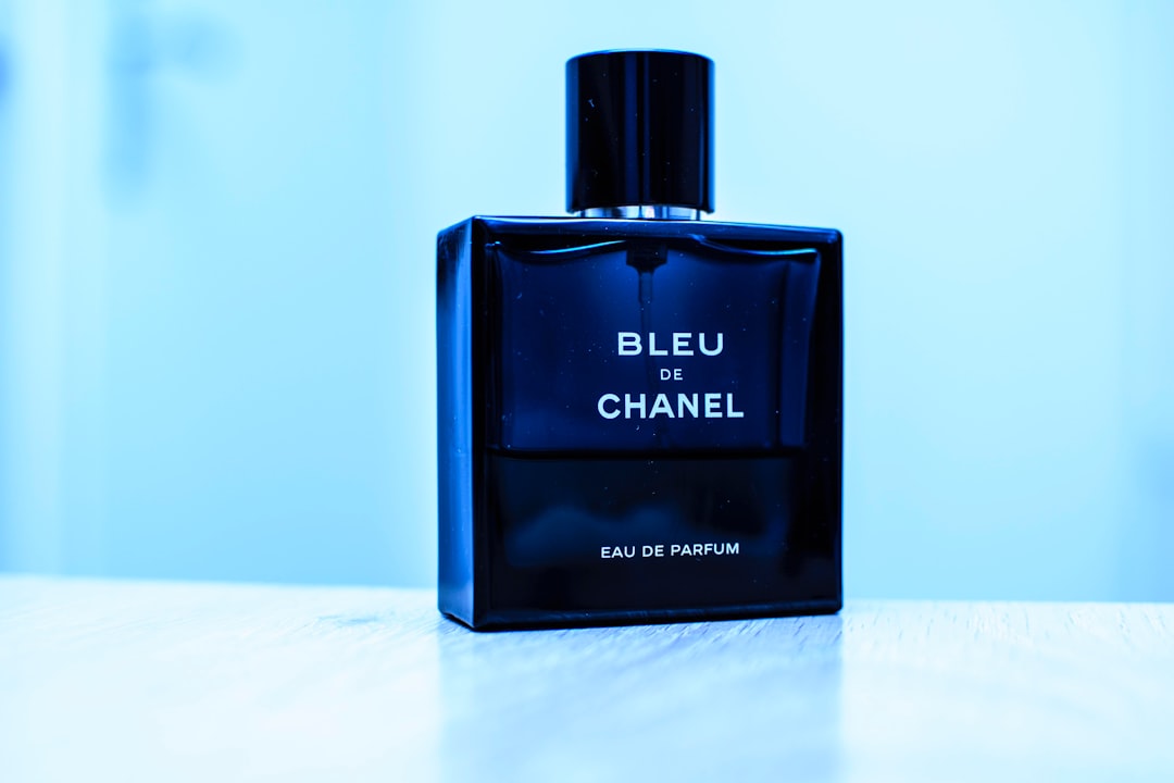 A close-up of a perfume bottle with a soft-focus background, showcasing elegance and sophistication.