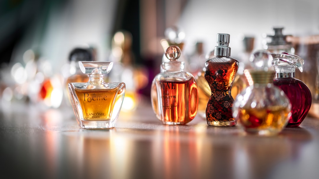 A close-up of perfume bottles with different colored liquids, showcasing the concept of fragrance layers.